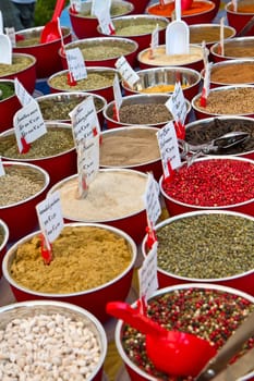 small boxes with different spices in market