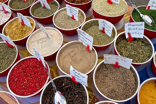 small boxes with different spices in market
