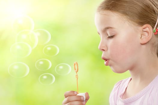 Young girl with soap bubbles