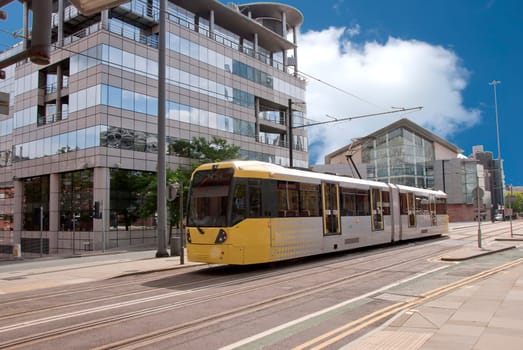 A Modern Yellow Tram on an English City Street