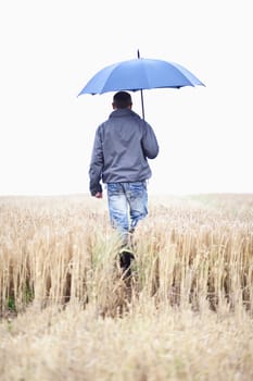 Farmer in front of a grain field
