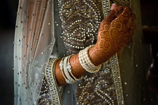 Image of henna on an Indian bride beautifully dressed