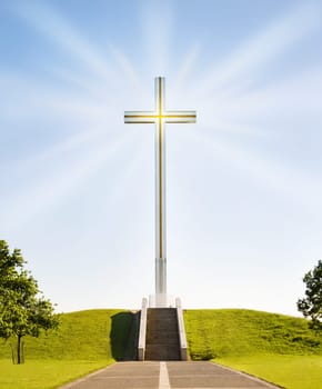 Shining Christian cross on the stairs to Heaven. The papal cross in Phoenix Park, Dublin, Ireland.