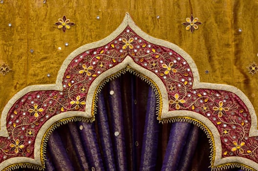 Closeup image detail of Indian fabric used in the decor of a wedding