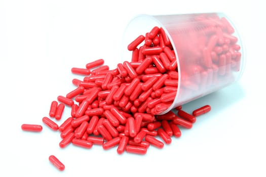 details of red pills isolated on white