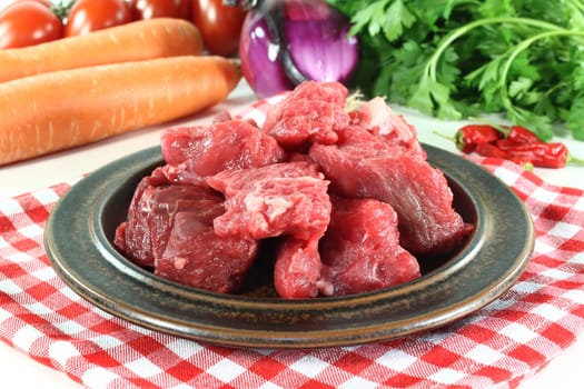 a plate of fresh,raw beef goulash