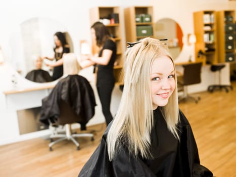 Young Blond Girl in the Hair Salon