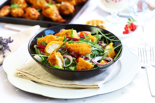 Big gourmet salad with mixed vegetable and curry chicken stripes