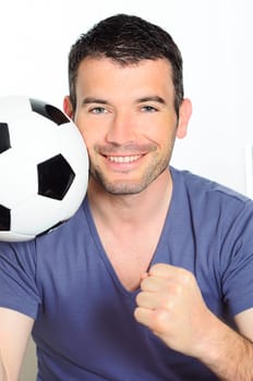 closeup of passionate soccer player with white and black balloon