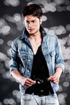 Fashion shot of a young man in the studio