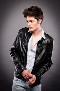 Fashion shot of a young man in the studio