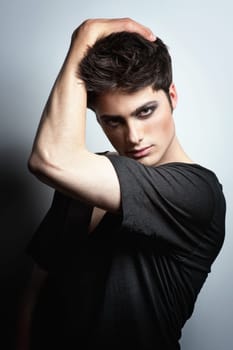 Fashion shot of a young man in the studio