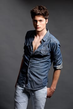 Fashion shot of a young man in the studio
