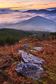 Mountains over the fog in the winter sunrise, Bizkaia, Spain