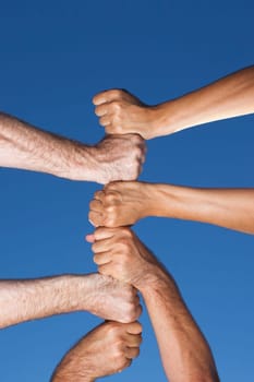 Six fists stacked on top of each other