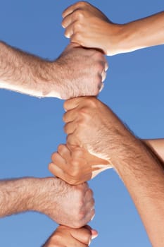 Six fists stacked on top of each other