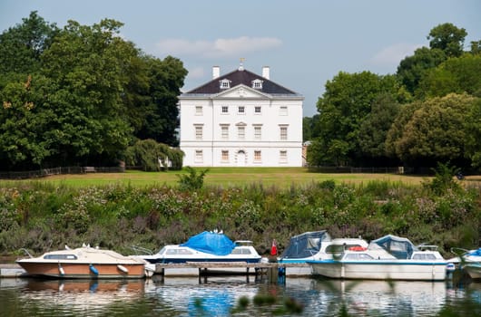 White house by the river Thames, England