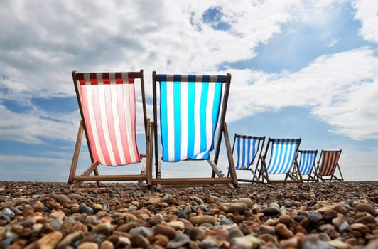 Empty deckchairs on brighton beach