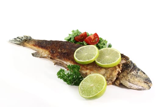 fried trout with salad and parsley