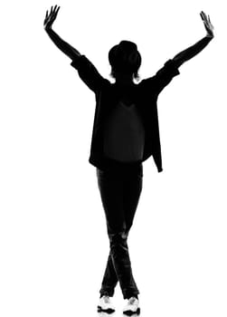 full length silhouette of a young man dancer dancing funky hip hop r&amp b on  isolated  studio white background