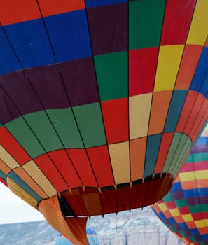 Two on the ground hot air balloons texture, vertical, multi colors and crop space