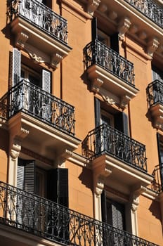 Tipical windows with metal balcony in the city of Madrid (Spain).