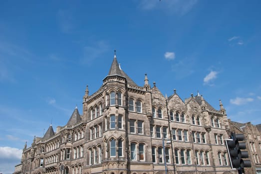 A Vintage Stone Built Office Block under a blue sky