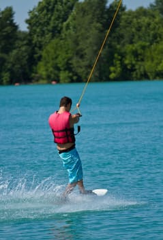 Man water skiing on a lake