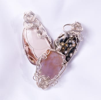 Pendants or cabochon stones wire wrapped in silver wire