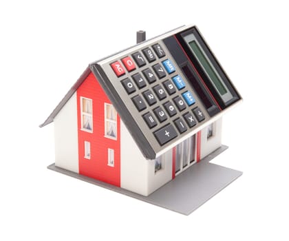 Home financing (cost of occupancy) concept - model of the house with calculator instead of the roof