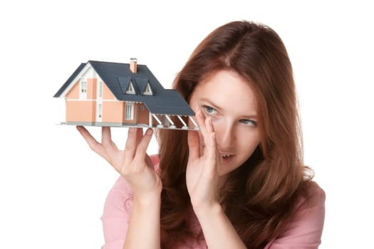 Woman (estate agency client or architect) browse new house represented by model