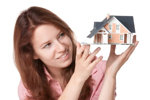 Woman (estate agency client) dream about new house - model of the house