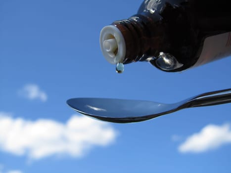 Dropper bottle with spoon