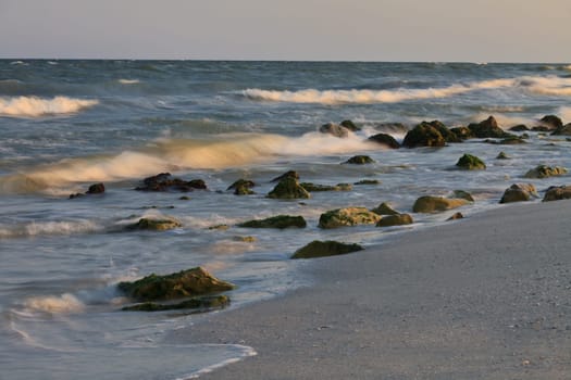 waves and rocks on a wild beach
