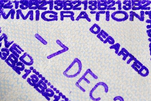 Immigration departed stamp, made on a airport when someone leaves the visiting country