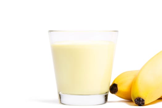 Bananas milkshake with bananas next to it on white background