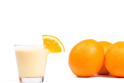 Milkshake with oranges on white background