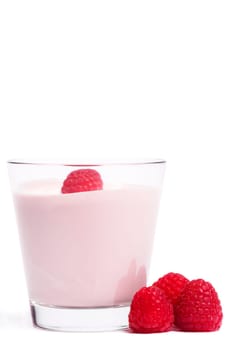 Milkshake with raspberries on white background