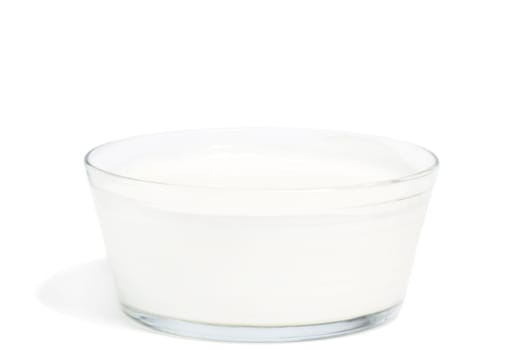 Yogurt in a bowl on white background