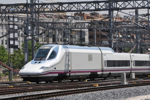 High speed passenger train just arriving at Atocha railway station in Madrid (Spain)