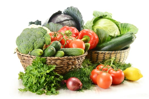 Composition with raw vegetables and wicker basket
