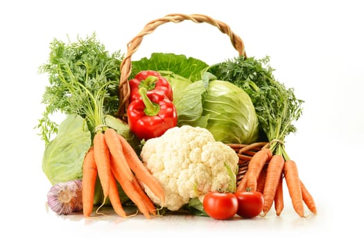 Composition with raw vegetables and wicker basket