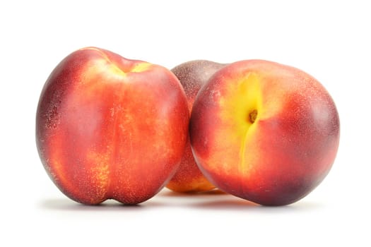 Fresh ripe peaches isolated on white