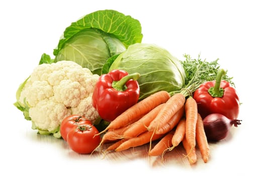 Composition with raw vegetables on white
