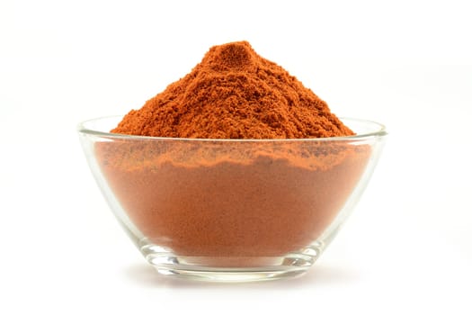 Small dish with cayenne pepper isolated on white