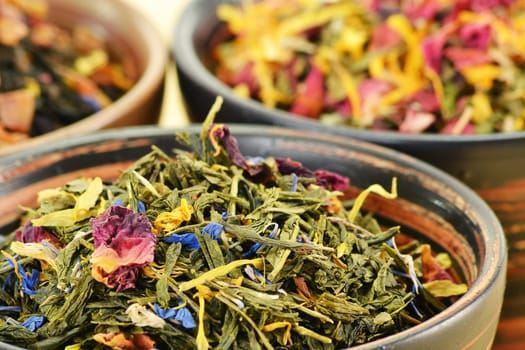 Composition with tea leaves in bowls