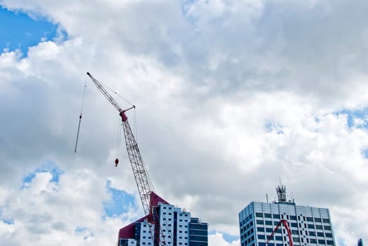Red Tower Crane and Twin Apartment Blocks