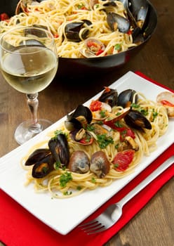photo of delicious pasta with clams and mussel