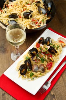 photo of delicious pasta with clams and mussel