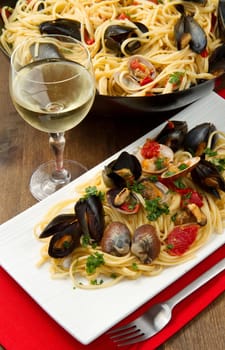 photo of delicious pasta with clams and mussel